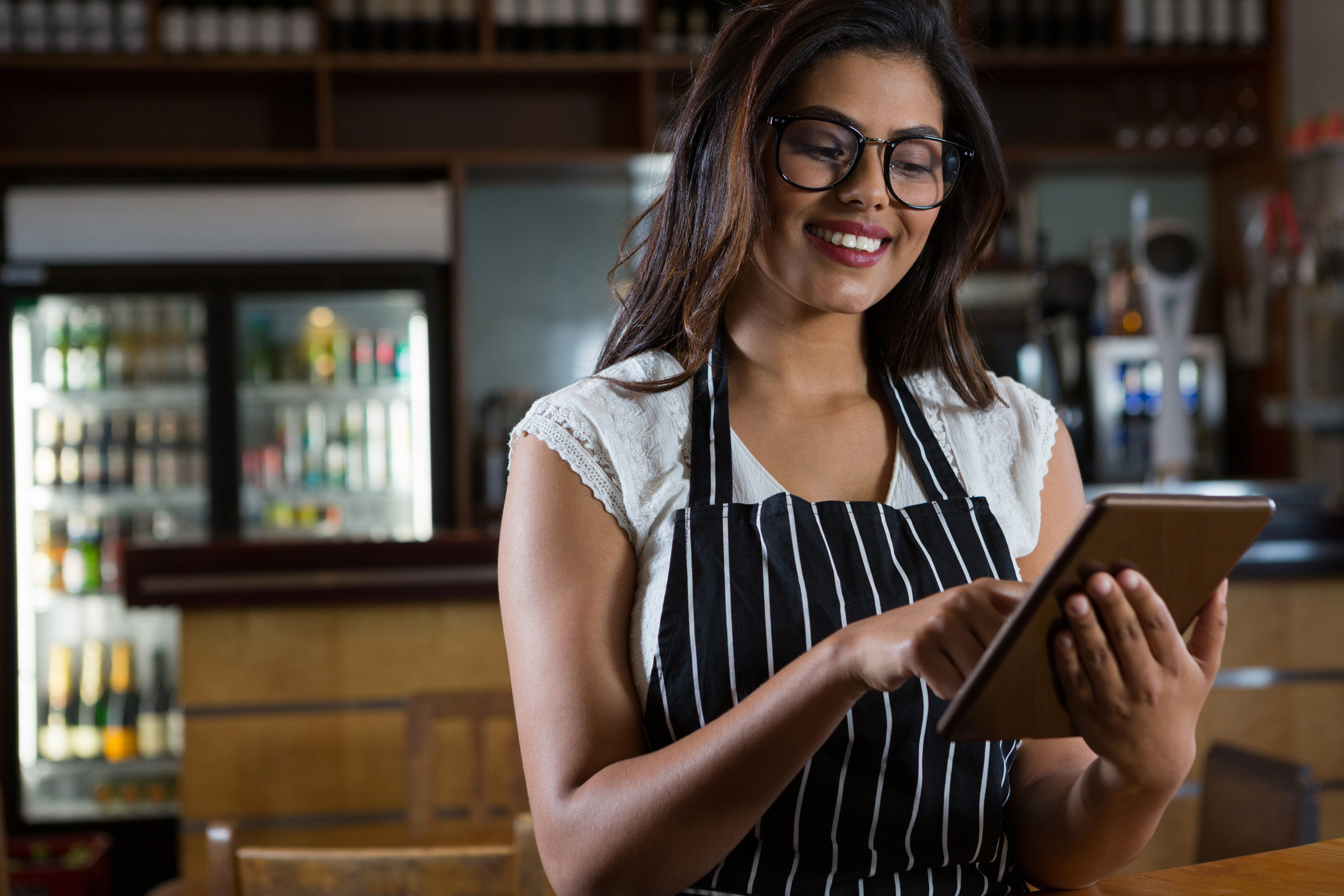 Waitress using digital tablet